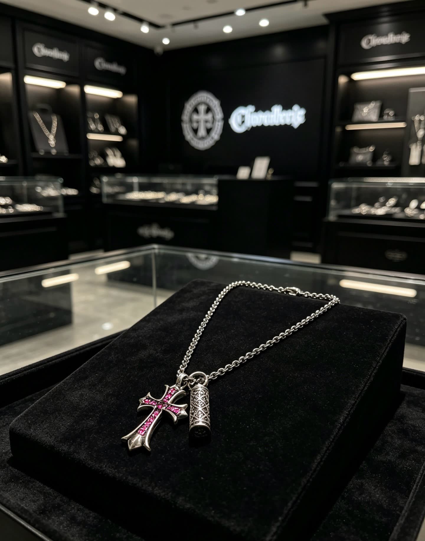 Chrome Hearts Silver Cross Pendant with Ruby Accents and cylindrical charm